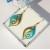 Turquoise earrings with handmade wire pattern